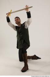 KEETA KNEELING POSE WITH SWORD